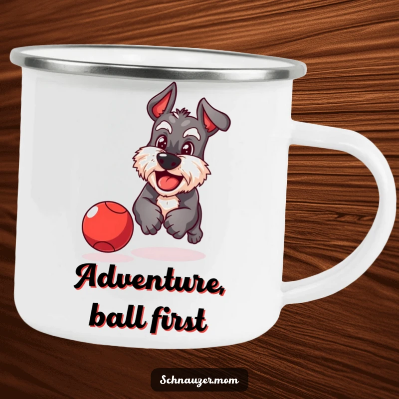 Funny Schnauzer camping mug of a playful dog with a determined grin chasing a bouncing red ball with focused energy.