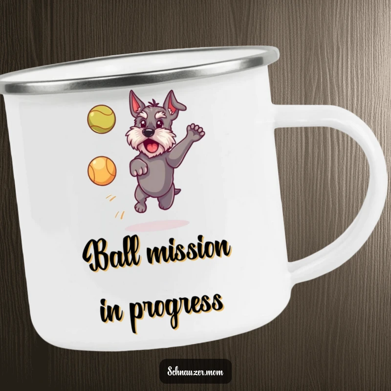 Funny Schnauzer dog camping mug, showing a dog leaping to catch a ball, ideal for enjoying hot drinks during outdoor escapades.