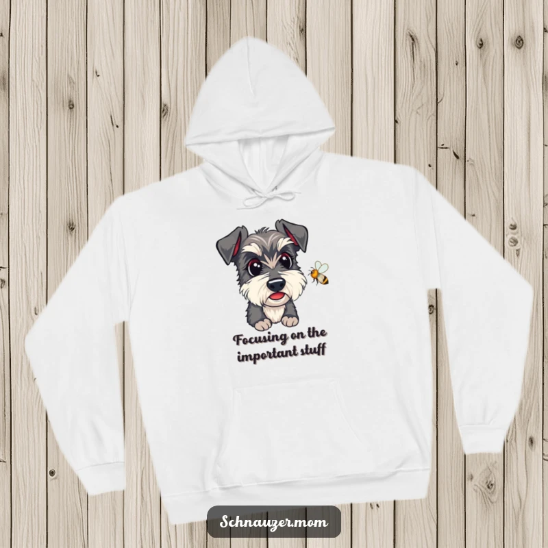 Funny Kawaii Schnauzer Hoodie, featuring an alert dog intently watching a bee, ideal for cold days.