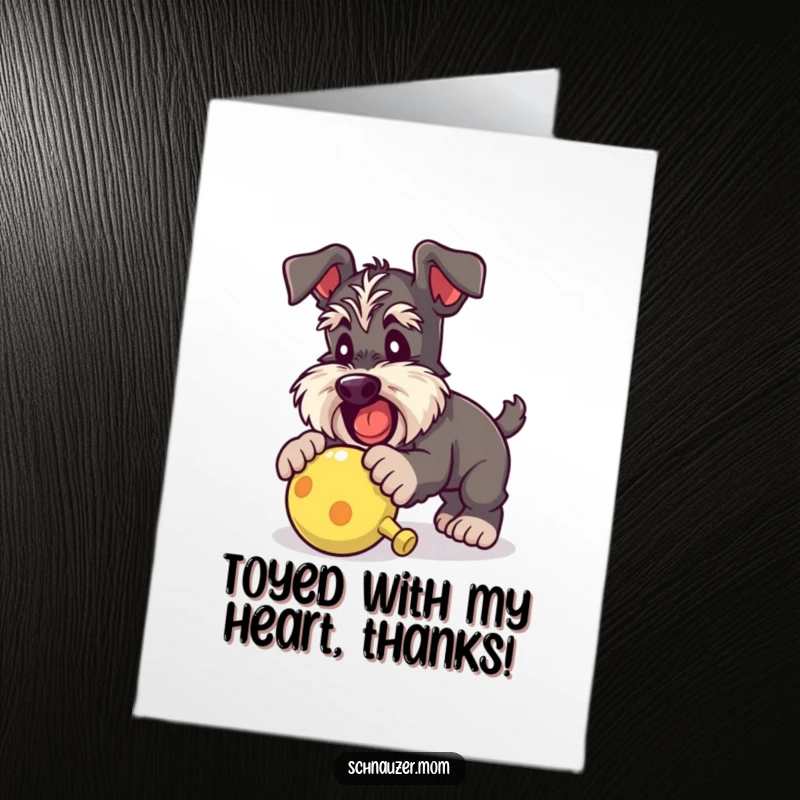 Funny Free Printable Schnauzer Thank You Card of a happy dog energetically pouncing on a favorite squeaky toy.