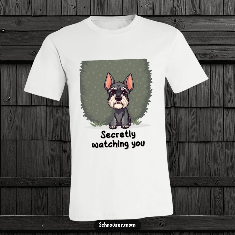 Funny Schnauzer dog t-shirt, a dog peeking coyly from behind a dense shrub, adding a touch of playful mystery.