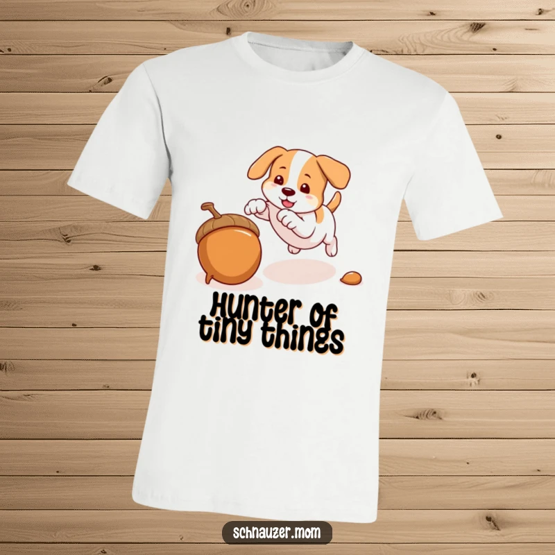 Funny t-shirt featuring a dog's quick pounce on an acorn, illustrating playful energy and agility, a fun gift.